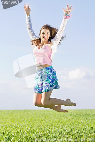 Image of Cheerful beautiful young woman