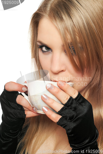 Image of Beautiful young blonde with a cup of tea. Isolated