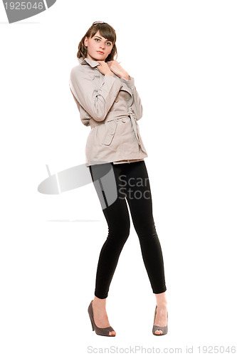 Image of Pretty young woman wearing a coat