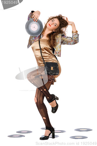 Image of Expressive young woman with vinyl disc