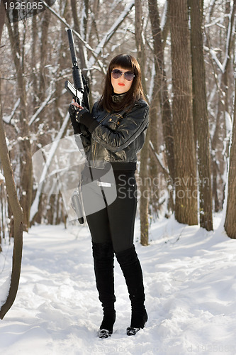 Image of Gorgeous girl with pistol holster