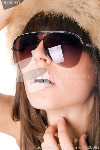 Image of sexy woman wearing sunglasses with sugar lips