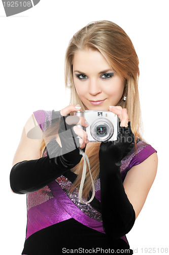 Image of Attractive blonde holding a photo camera. Isolated