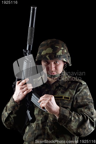 Image of Soldier reloading magazine of m16 