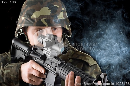 Image of Soldier with the smoking gun. Closeup