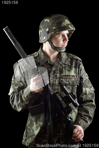 Image of Soldier grasping a gun