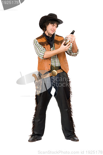 Image of Happy cowboy with a bottle