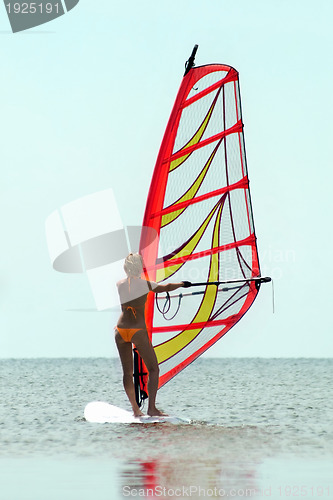 Image of Silhouette of a girl windsurfer 