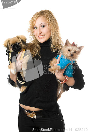 Image of Portrait of smiling young blonde with two dogs