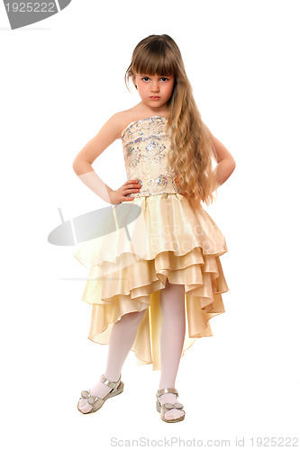 Image of Beautiful little girl in a beige dress