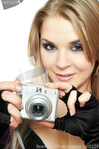 Image of Smiling beautiful woman holding a photo camera