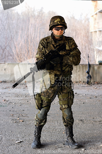 Image of Military guy holding a gun