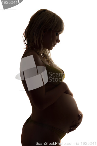 Image of Silhouette of a pregnant young woman. Isolated