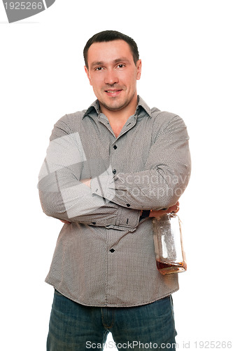 Image of Smiling man with a bottle of whiskey