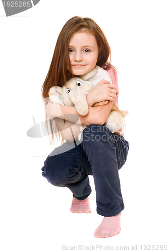 Image of Beautiful little girl with a teddy elephant