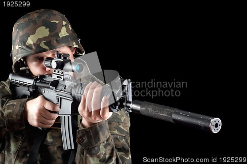 Image of Armed man taking aim