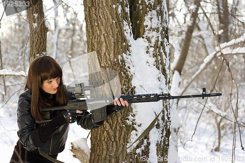 Image of Beautiful woman with a sniper rifle