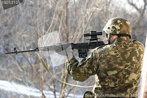 Image of Portrait of soldier with a sniper rifle