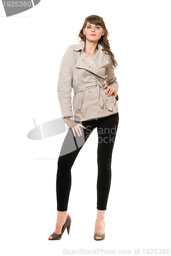 Image of Sexy young woman wearing a coat 