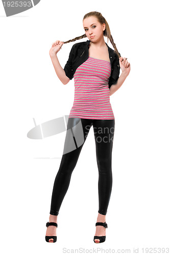 Image of Playful pretty young woman in black leggings