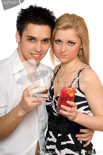 Image of Smiling beautiful young couple with cocktails