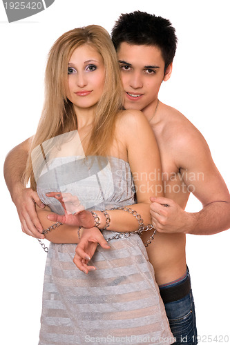 Image of Young man and blonde in chains