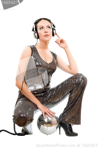 Image of Attractive young brunette in headphones