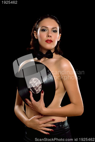 Image of Gorgeous young woman topless with vinyl