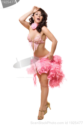 Image of Young brunette in pink dancing dress. Isolated