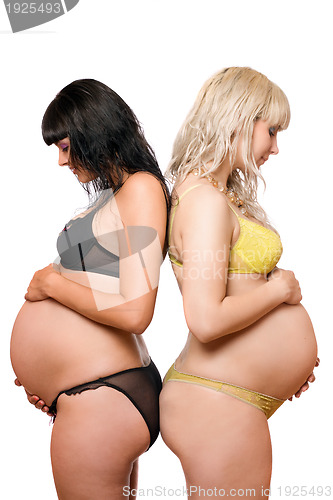 Image of Two pregnant young women. Isolated