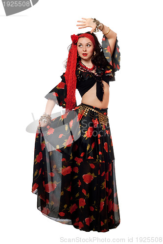 Image of Dancing gypsy woman in a black skirt. Isolated
