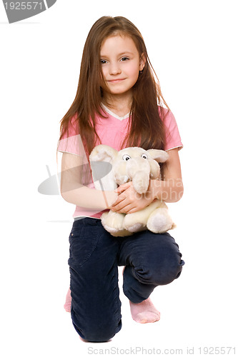 Image of Pretty little girl with a teddy elephant