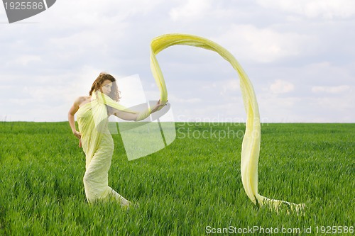 Image of Charming young woman dancing