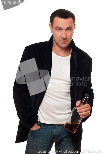 Image of Man with a bottle of scotch. Isolated