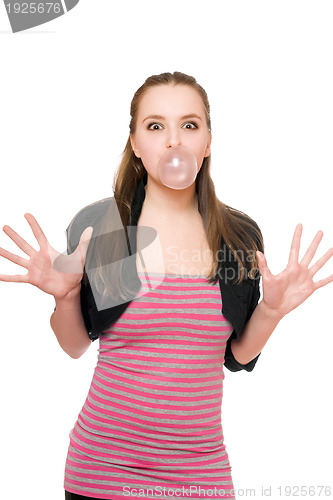 Image of Young woman blowing a bubble