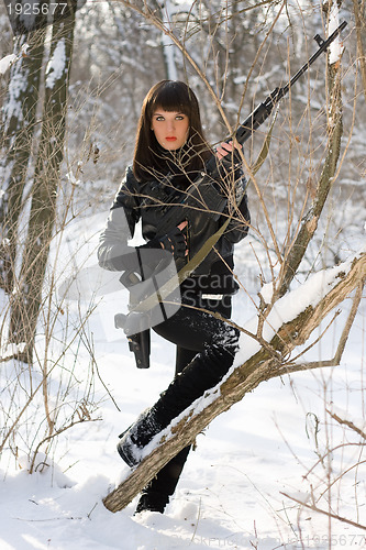 Image of Attractive woman with a sniper rifle