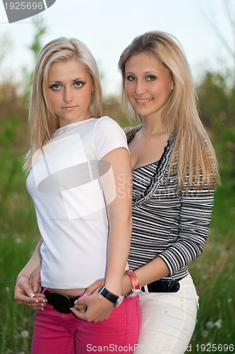 Image of Portrait of two smiling attractive young women