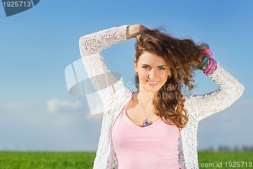 Image of Portrait of joyful charming young woman