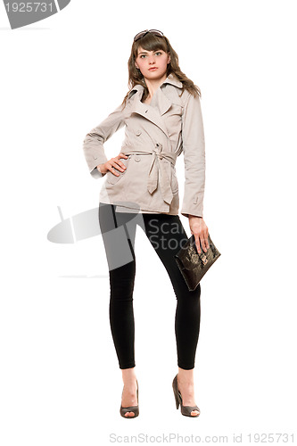 Image of Cute girl wearing a coat and black leggings