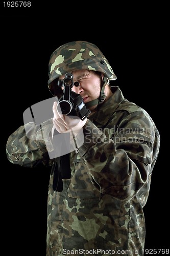 Image of Armed man pointing a gun