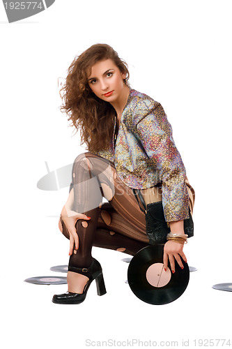 Image of Beautiful young woman with vinyl disc