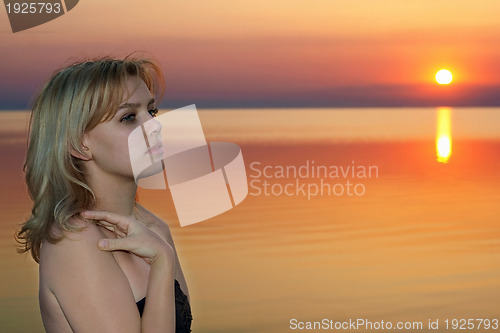 Image of young blonde at sunset