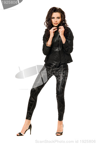 Image of Charming young brunette in black clothes. Isolated