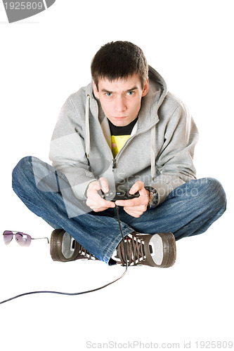 Image of Young man with a joystick for game console. Isolated