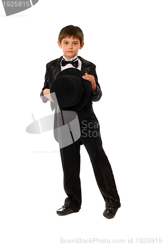 Image of Little boy in tuxedo with a hat