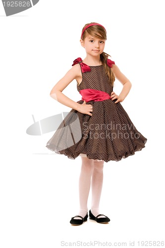 Image of Cute little lady in a brown dress