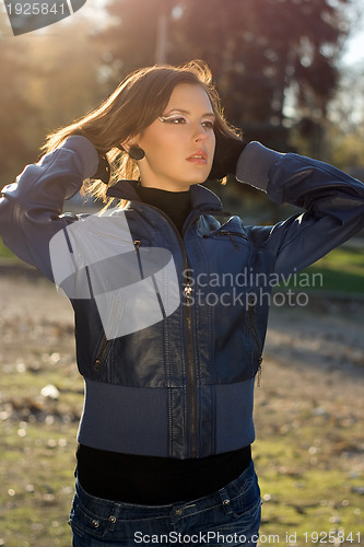 Image of charming girl in autumn park