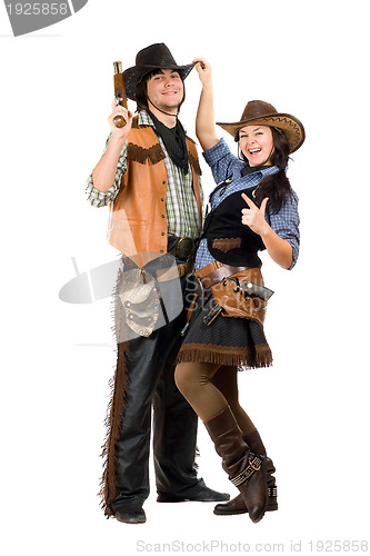 Image of Cheerful young cowboy and cowgirl