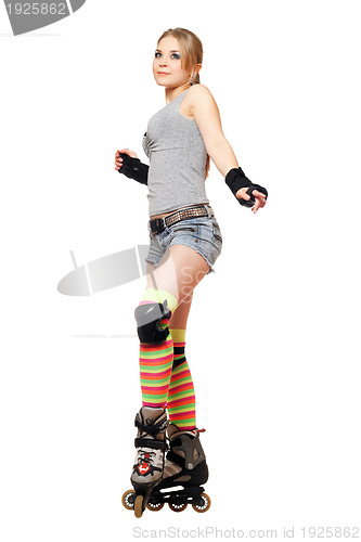 Image of Attractive young blonde on roller skates