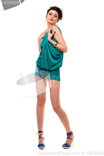 Image of Playful young woman in a blue dress. Isolated